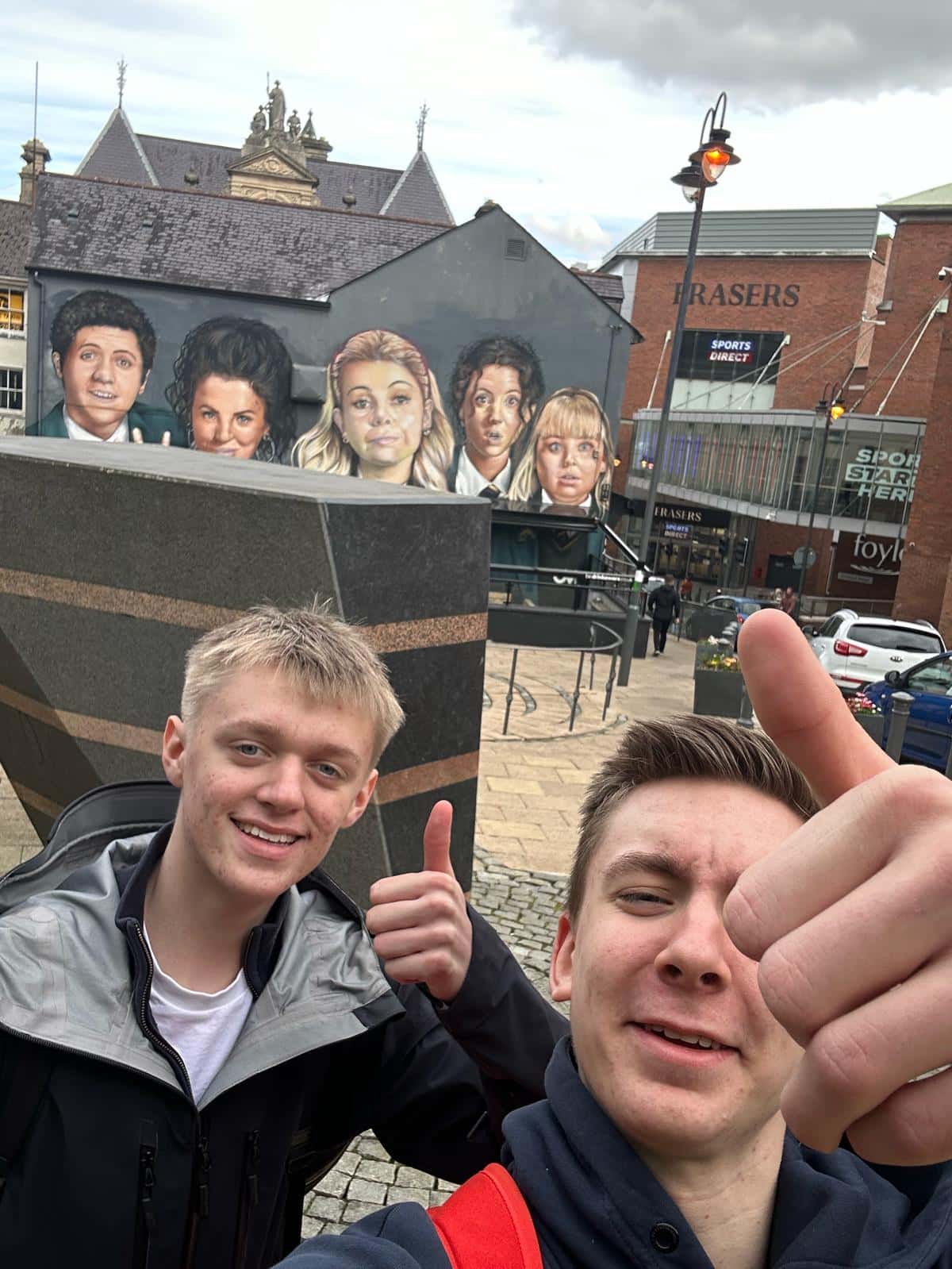 Students at the Derry Girls mural